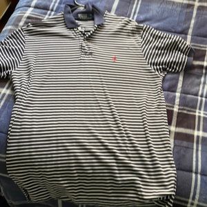 Navy blue and white stripes men’s polo with red logo. Barely used.